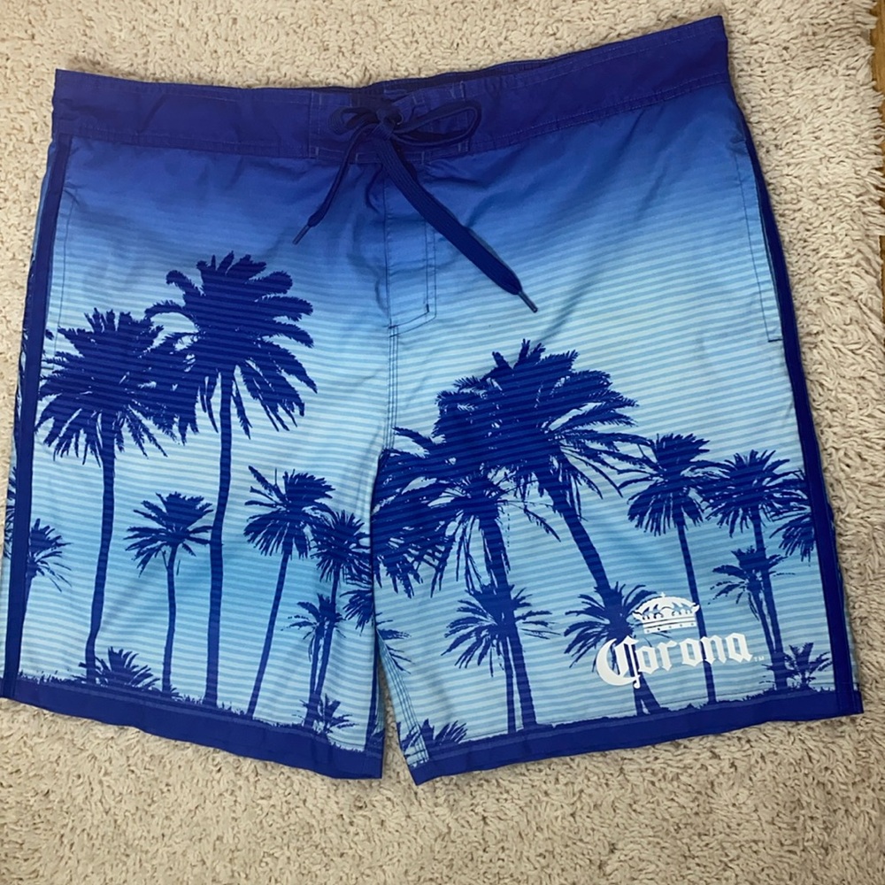 Corona board shorts blue with palm trees size XXL says Corona in the front